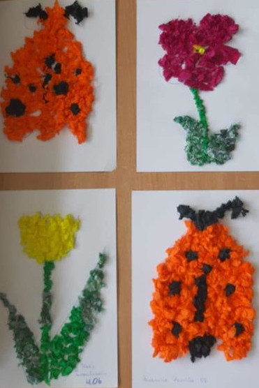 Prace świetliczaków - wykonane z kulek papieru dwie pomarańczowe biedronki, żólty tulipan, czerwony kwiatek.